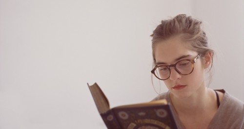 MYKITA glasses girl reading The House of Eyewear Paris